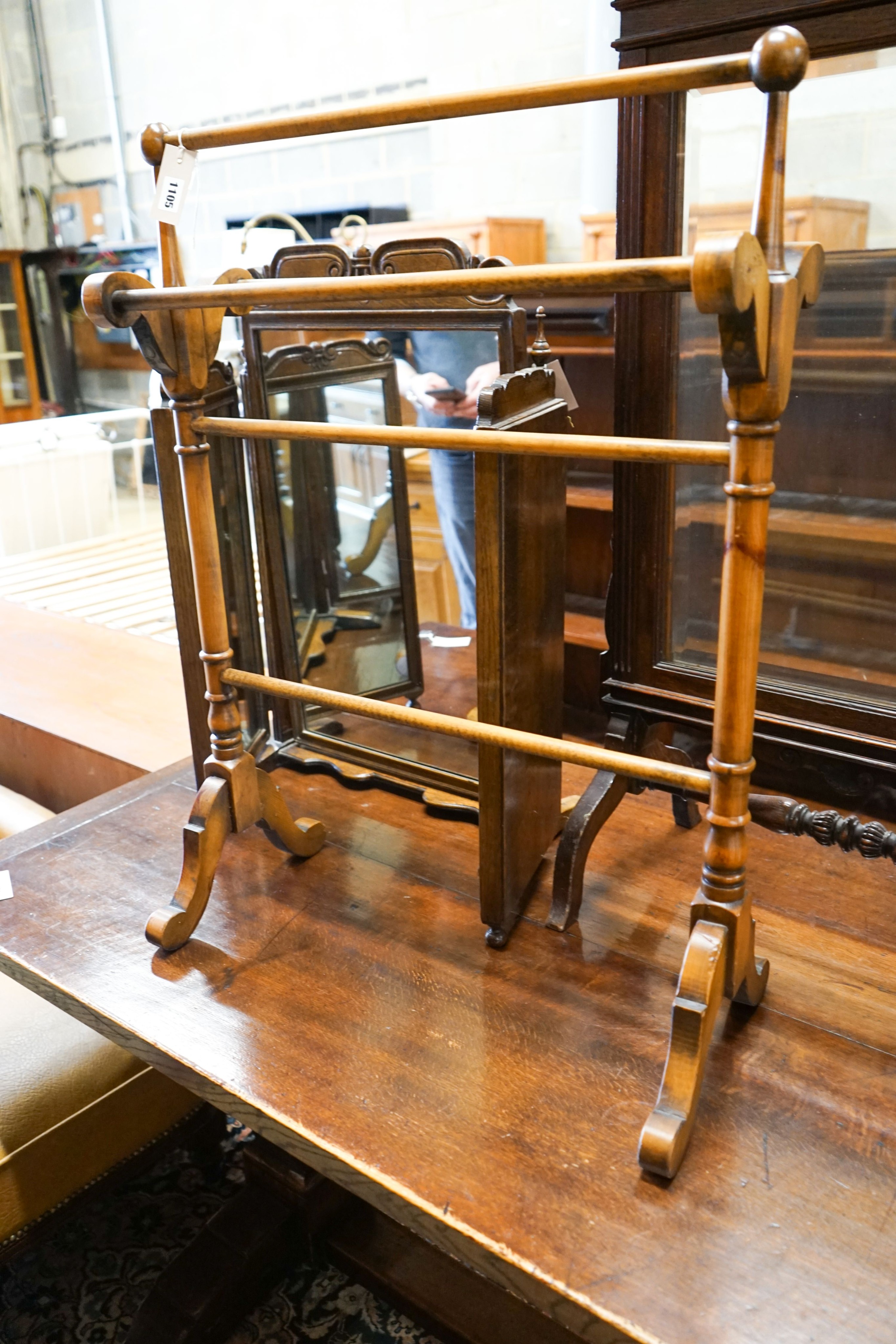 An oak triple mirror, a towel rail, an oak firescreen and two toilet mirrors
